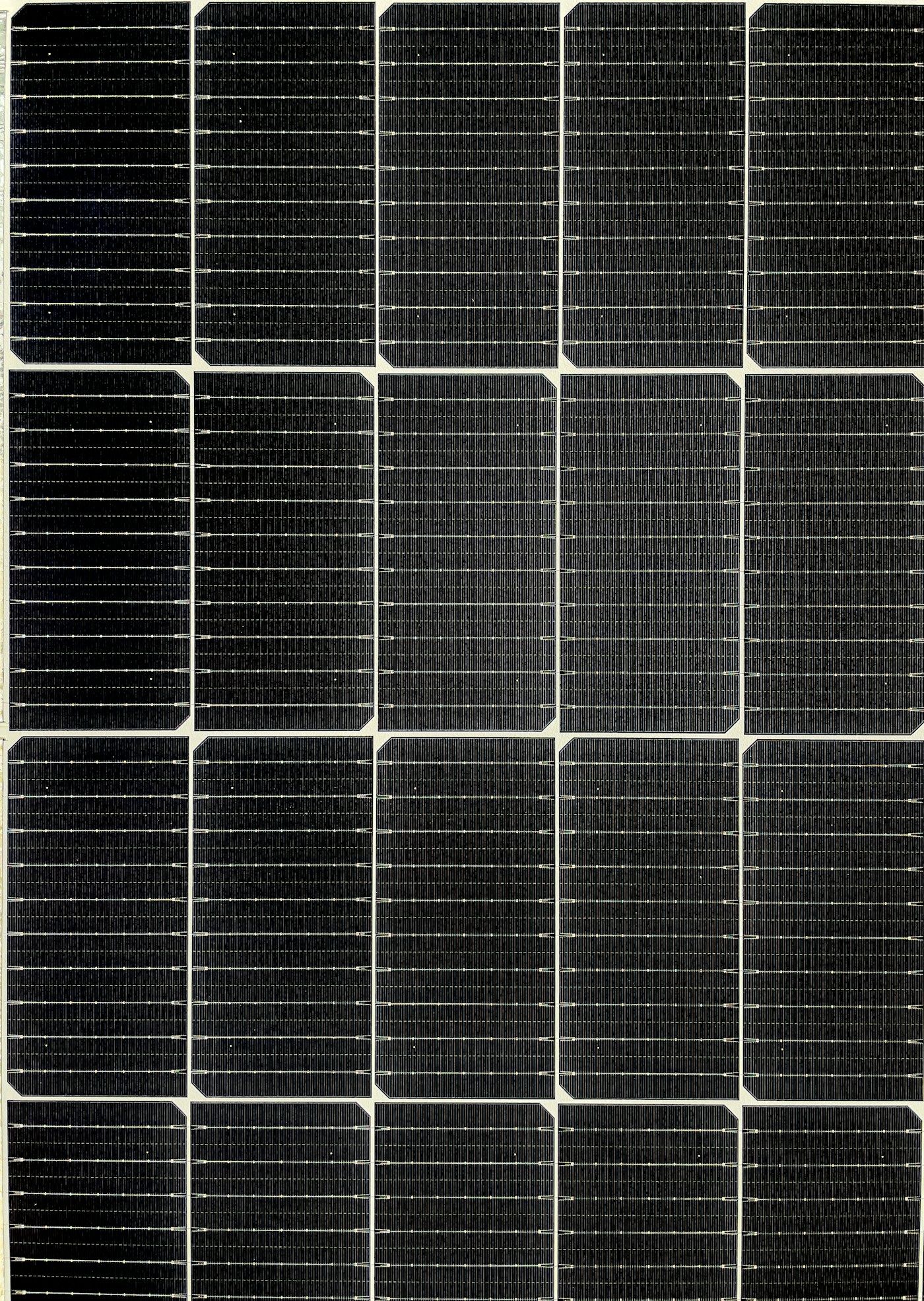 Abstract close-up of solar panel cells in a geometric grid pattern